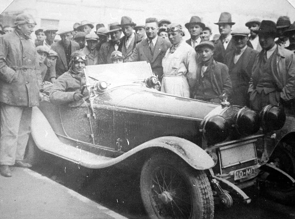 Enzo Ferrari - Giuseppe Campari on Alfa Romeo 1750 6C Compressore; standing in center (from left) Enzo Ferrari and Achille Varzi.