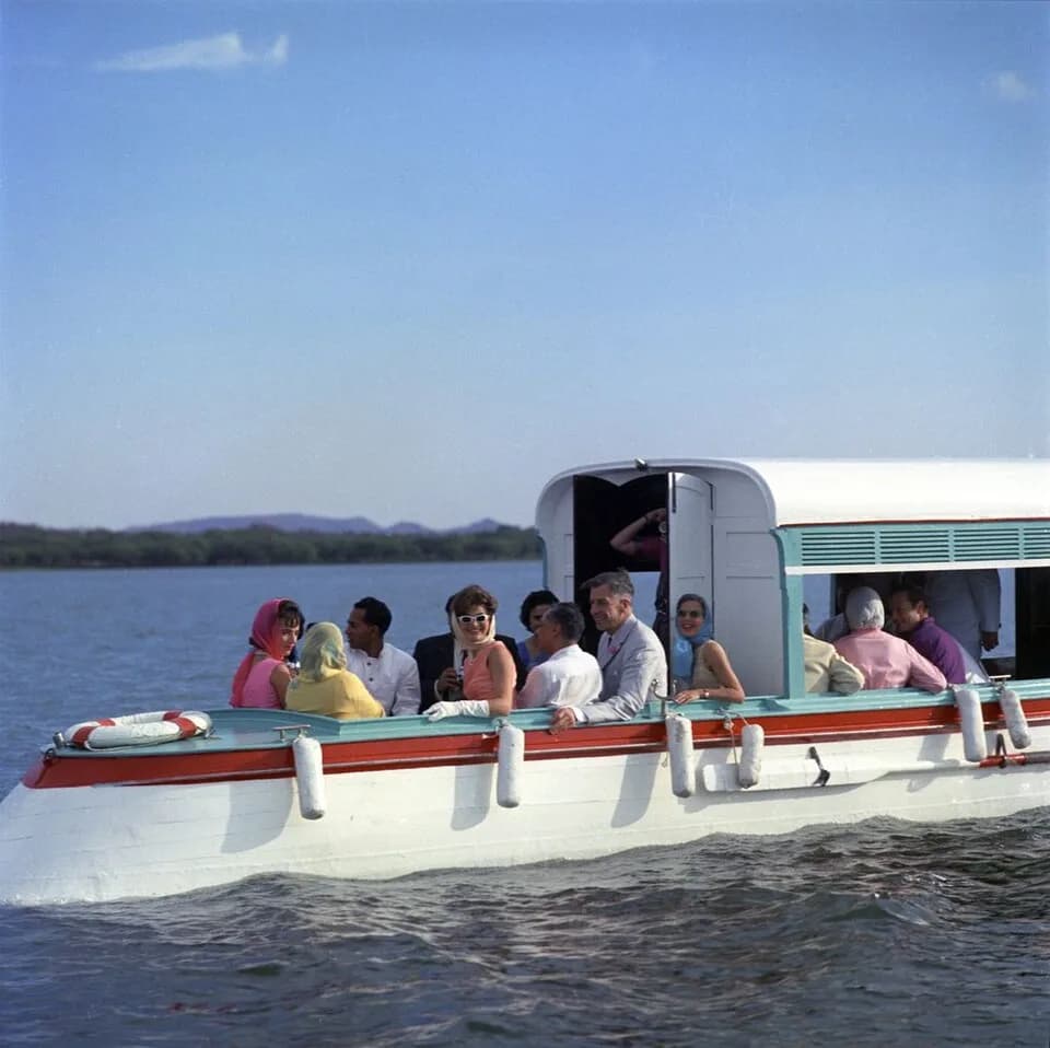 John Kenneth Galbraith - First Lady Jacqueline Kennedy takes a boat ride on Lake Pichola in Udaipur, Rajasthan, India. L-R: The First Lady’s sister, Princess Lee Radziwill of Poland; unidentified; the