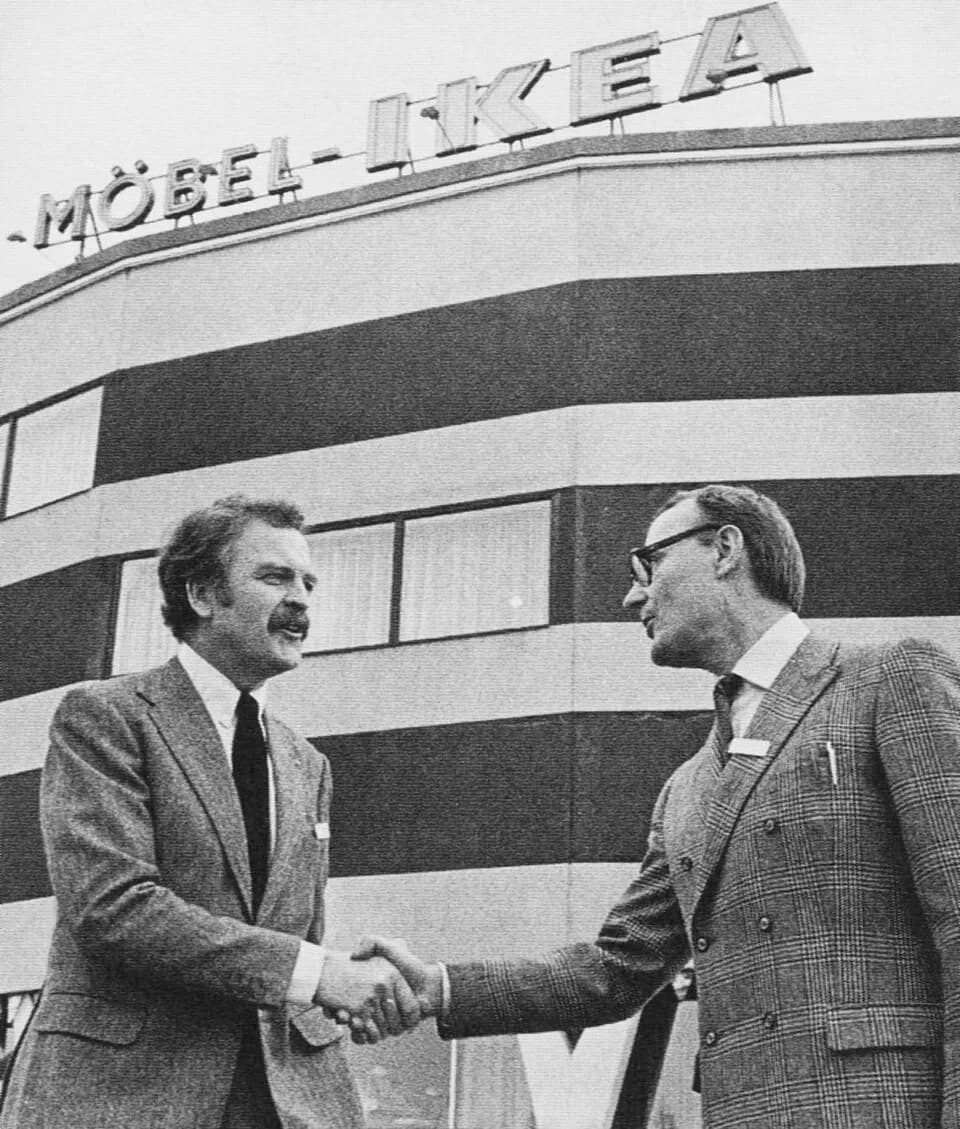 Ingvar Kamprad - Hans Ax (left),  IKEA's first store manager, shakes hands with IKEA founder Ingvar Kamprad
