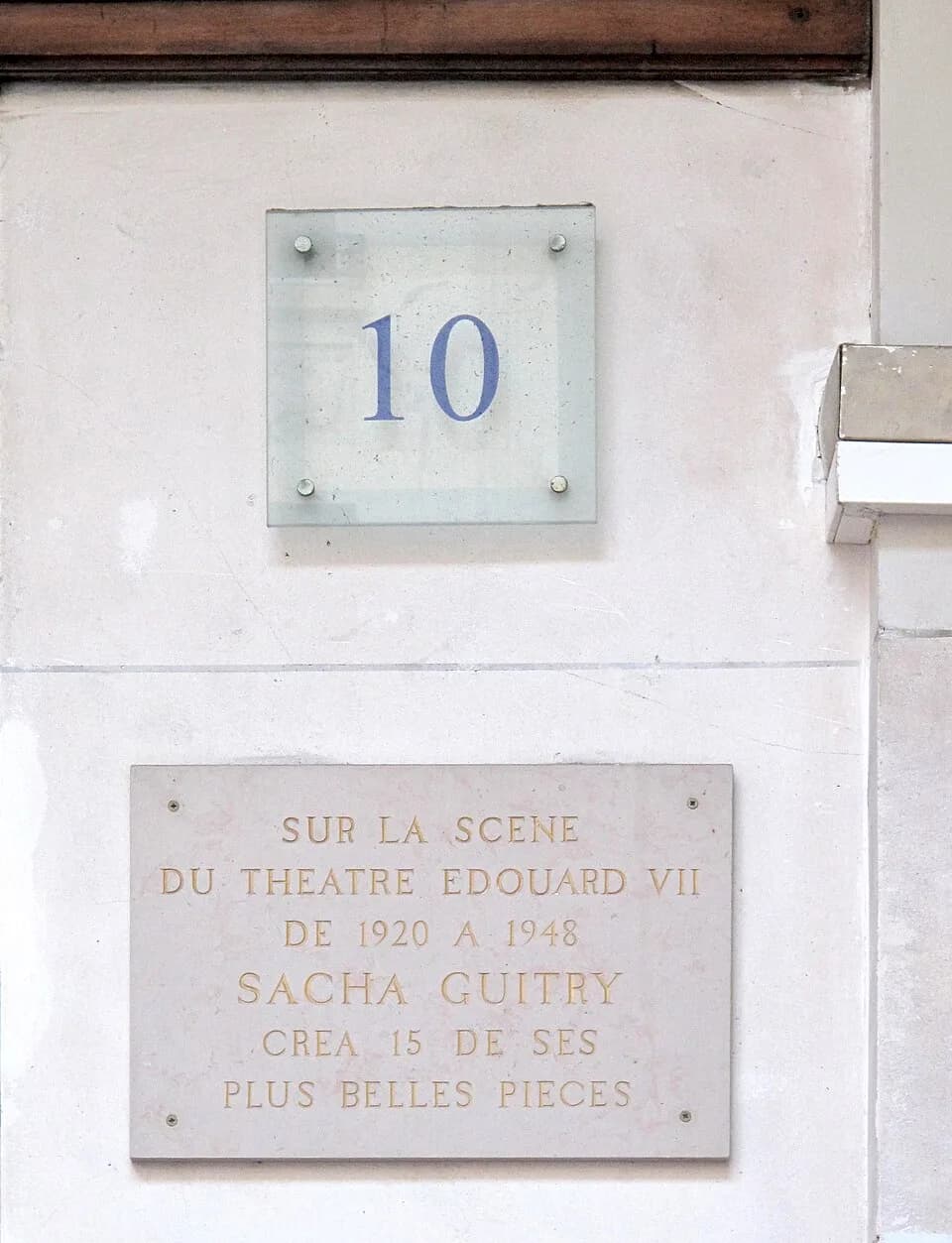 Sacha Guitry - Plaque on a wall of the theater Edouard VII where the French writer Sacha Guitry created several of his pieces of theater : 10 place Edouard-VII, Paris 9th arrond.