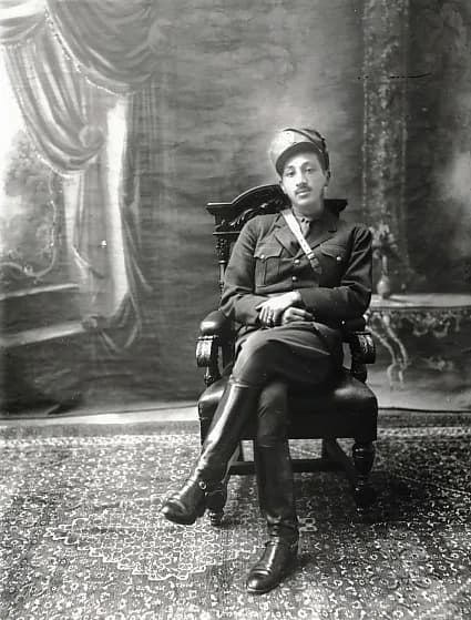 Mohammed Zahir Shah - Studio photograph of Mohammad Zâher Khân, son of Mhd Nâder Shâh, in military uniform, seated in a heavy carved armchair. Accession number: 2006.1387 Inventory number: NA 28