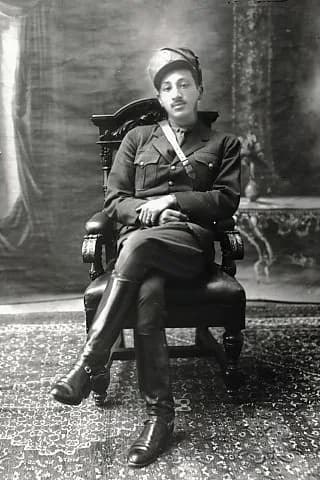 Mohammed Zahir Shah - Studio photograph of Mohammad Zâher Khân, son of Mhd Nâder Shâh, in military uniform, seated. Accession number: 2006.1387 Inventory number: NA 28