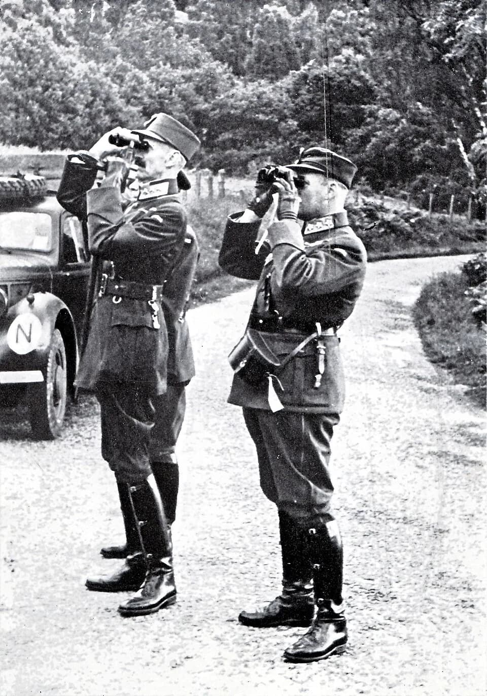 Haakon VII of Norway - King Haakon VII and Crown Prince Olav inspecting an exercise in the United Kingdom during World War II.