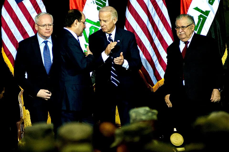 Jalal Talabani - Iraqi Prime Minister Nouri al-Maliki talks to U.S. Vice President Joe Biden after gihe gave a speech during the Iraqi government's Day of Commitment ceremony in the Al Faw Palace on V