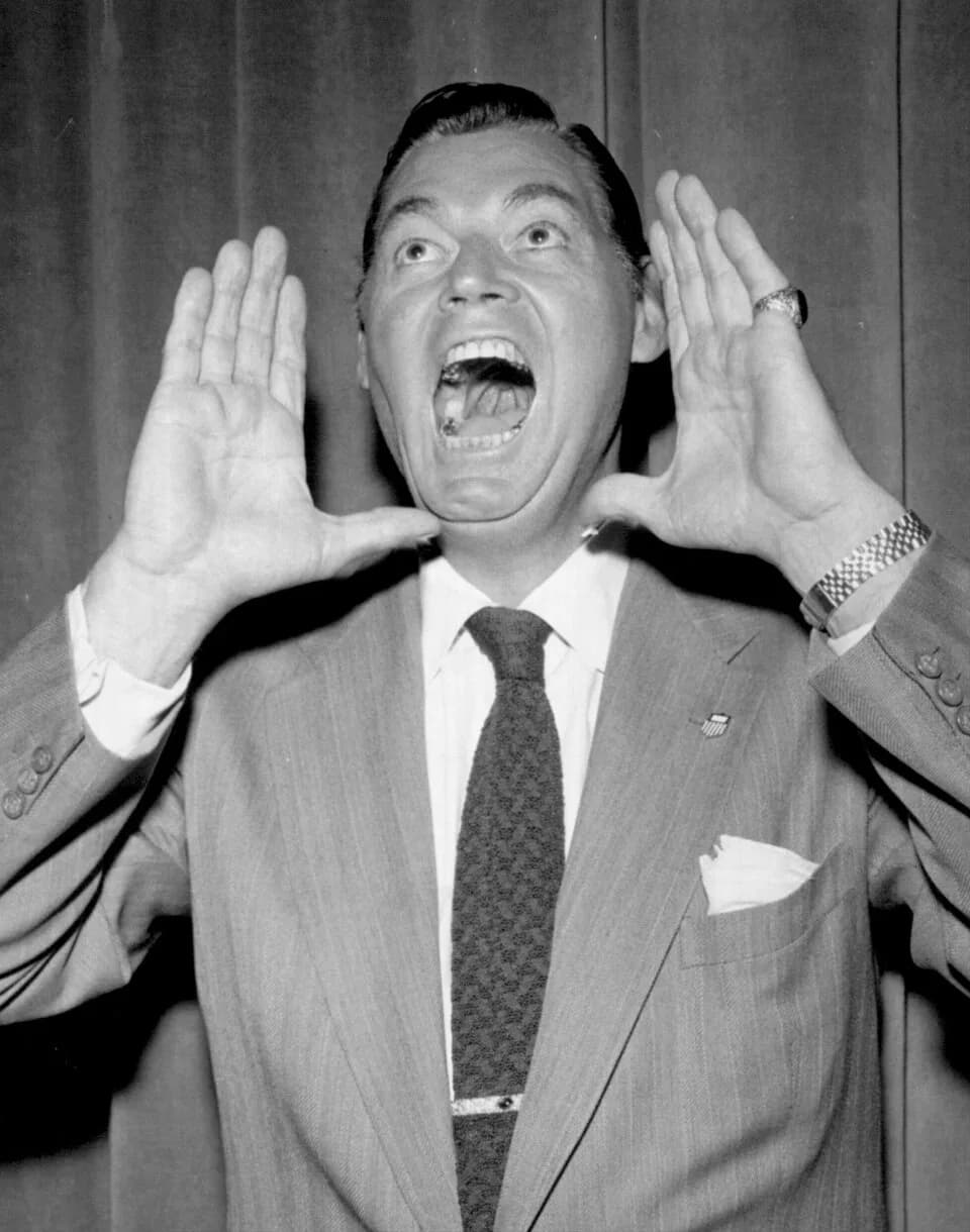 Johnny Weissmuller - Photo of Johnny Weissmuller doing his Tarzan yell for the camera.