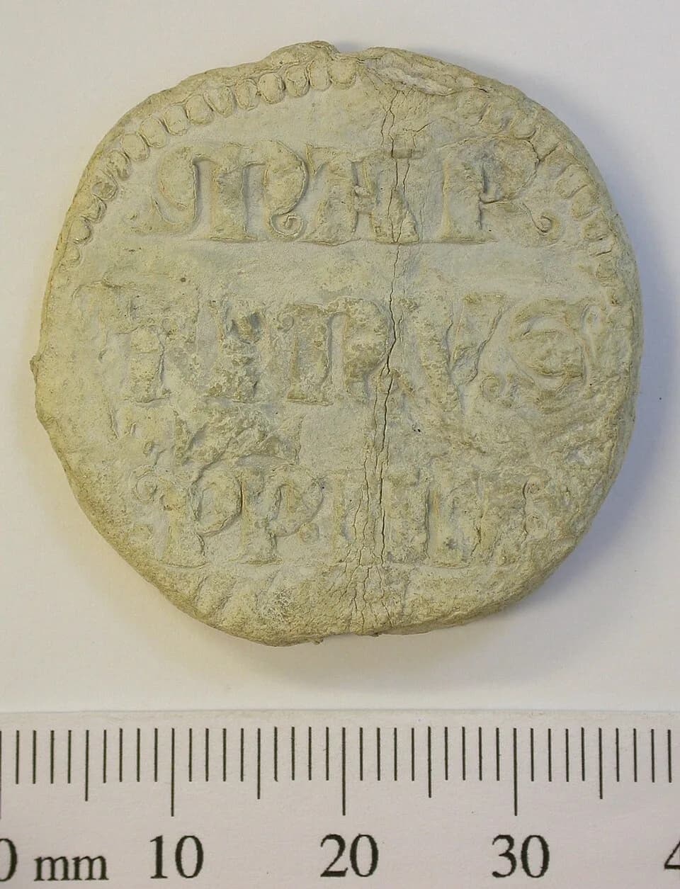 Martin IV - Papal bulla of Pope Martinus IV, 1281-5. The obverse has three lines of writing, MAR/TINVS/PP.IIII, all within a beaded border. The reverse shows two bearded male heads within beaded borde