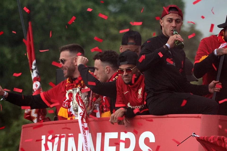 Diogo Jota - Players of Liverpool FC celebrating their cup double in a trophy parade in May 2022