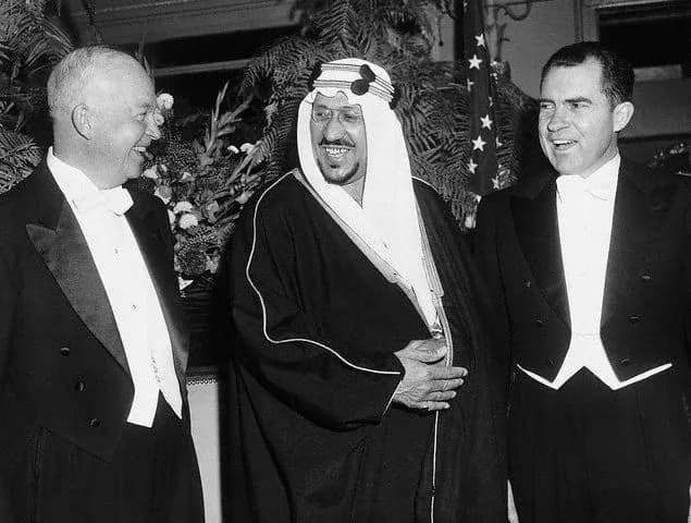 Saud of Saudi Arabia - President Eisenhower (L) and Vice President Richard Nixon (R) are shown with their host, King Saud of Saudi Arabia (C), as they attended the regally-arranged dinner given by the