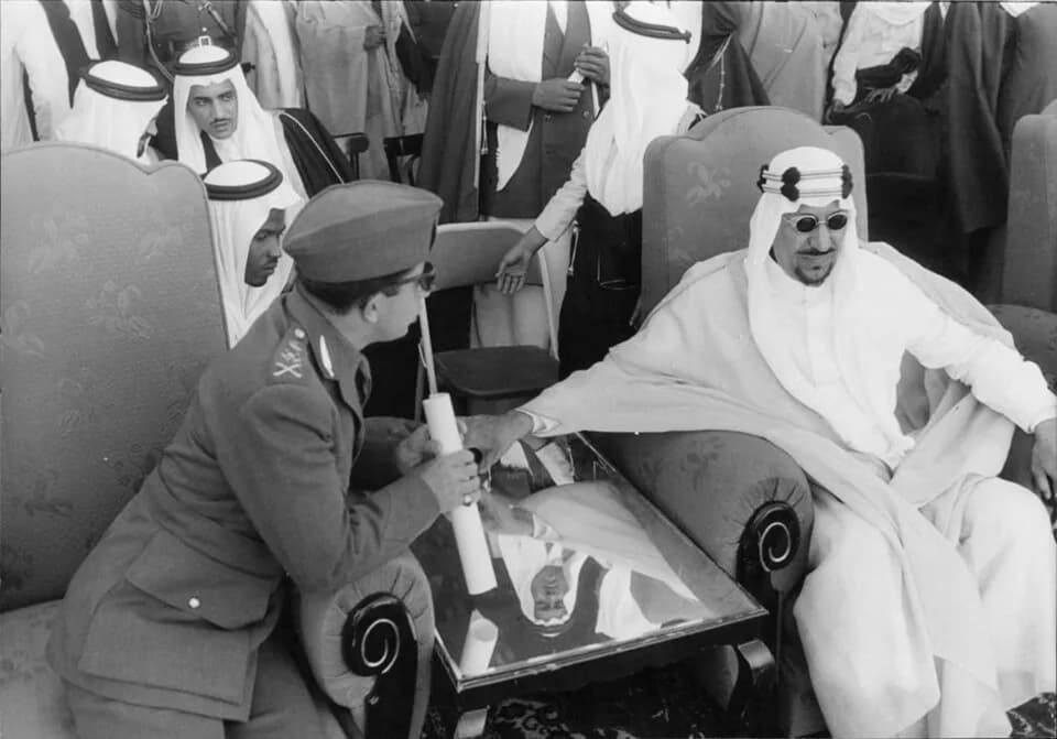 Saud of Saudi Arabia - A military official taking to King Saud of Saudi Arabia.