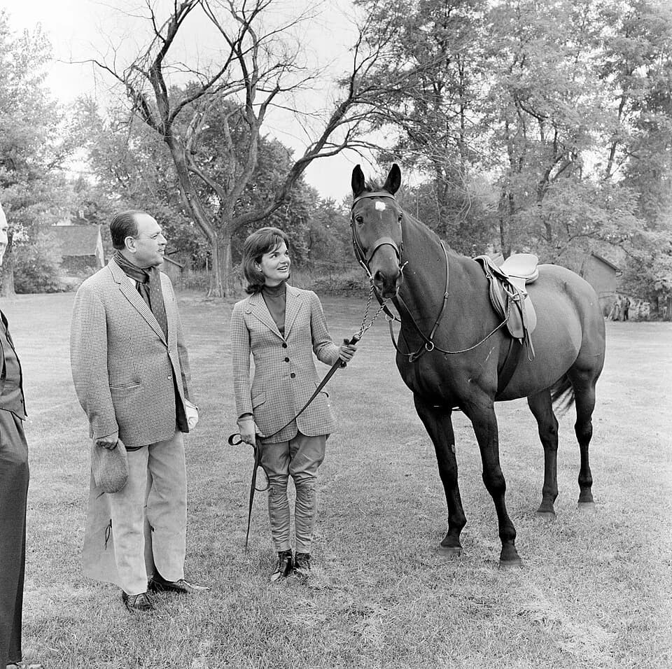 Ayub Khan - First Lady Jacqueline Kennedy visits with President of Pakistan, Muhammad Ayub Khan, on the grounds of Glen Ora in Middleburg, Virginia. Standing at right is “Sardar,” a horse presented to