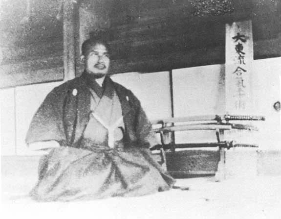 Morihei Ueshiba - Morihei Ueshiba seated in seiza in his Ayabe dojo.