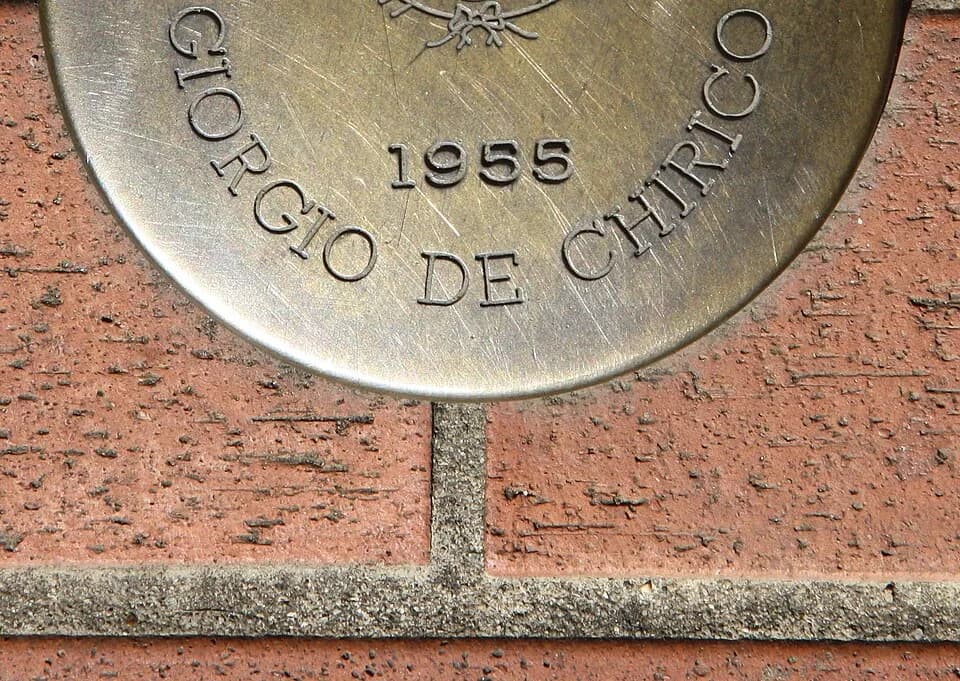 Giorgio de Chirico - Italy, Tuscany, Montecatini Terme, Viale Verdi. The circular brass plate placed along Viale Verdi to remember the celebrities who stayed in town. The commemorative inscription rep