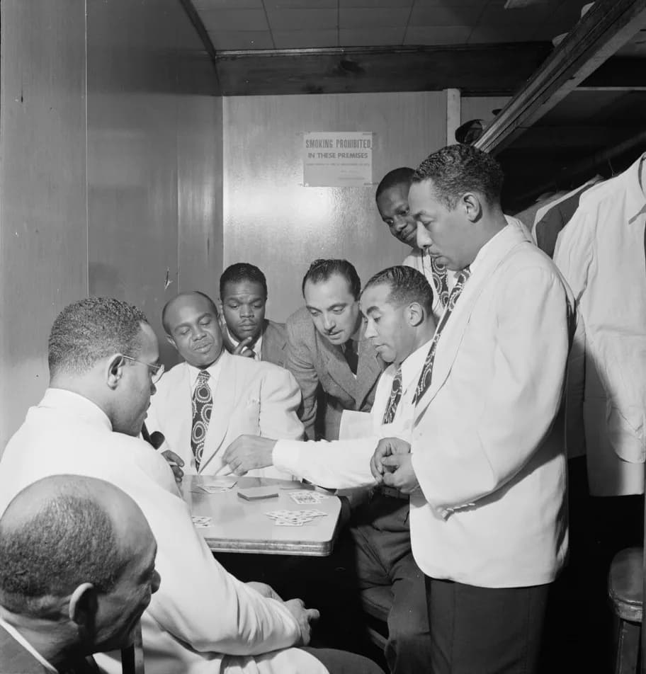 Django Reinhardt - Photography by William P. Gottlieb: Al Sears, Shelton Hemphill, Junior Raglin, Django Reinhardt, Lawrence Brown, Harry Carney, Johnny Hodges at Aquarium, NYC, ca. November 1946