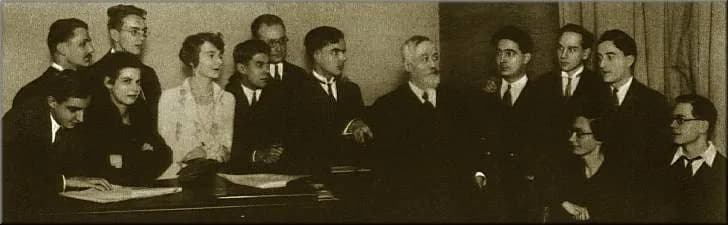 Olivier Messiaen - From left to right, near the piano: Pierre Maillard-Verger, Elsa Barraine, Yvonne Desportes, Tony Aubin, Pierre Revel, Georges Favre, Paul Dukas, René Duclos, Georges Hugon, Maurice