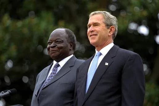Mwai Kibaki - U.S. President George W. Bush and Kenyan President Mwai Kibaki watch the military review portion of the State Arrival Ceremonies on the South Lawn of the White House Monday, October 5, 2