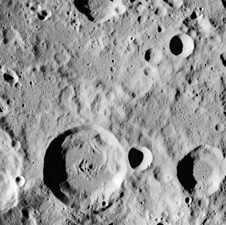Arne Tiselius - Lunar craters Tiselius (lower left) and Stein (lower right). Apollo-16 image AS16-M-0017.  Approximate north is at top.