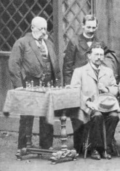 Siegbert Tarrasch - Vienna 1898 chess tournament Participants Adolf Schwarz (left), Carl Schlechter (right), Siegbert Tarrasch (sitting)