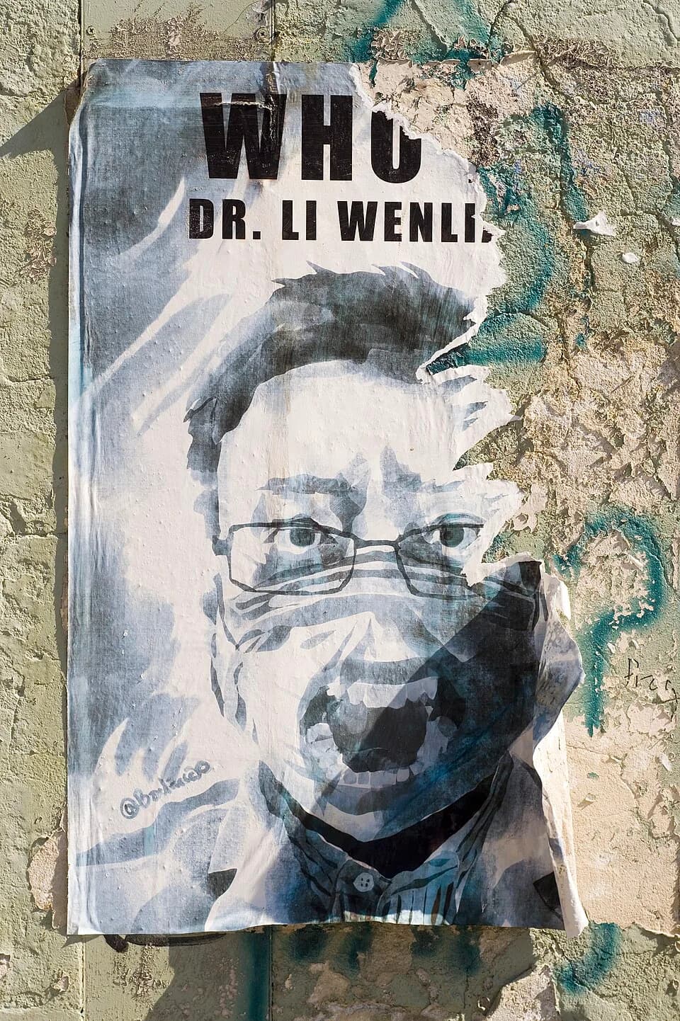 Li Wenliang - Partially damaged picture of Dr. Li Wenliang on the wall poster.