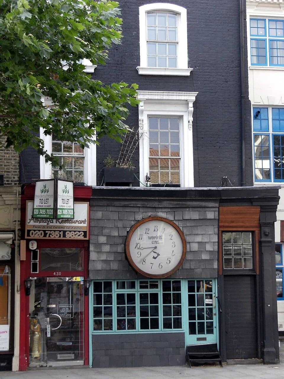 Vivienne Westwood - Athitaya Restaurant, (left) 430 King's Road,
London SW10 0LJ, Thai food restaurant. The Shop with the Large clock on it is World's End – Vivienne Westwood 430 King's Rd, London, Gr