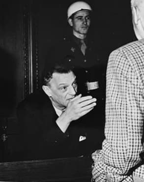 Arthur Seyss-Inquart - Defendant Arthur Seyss-Inquart talks to fellow defendant Wilhelm Frick during a court recess at the International Military Tribunal trial of war criminals at Nuremberg, [Bavaria