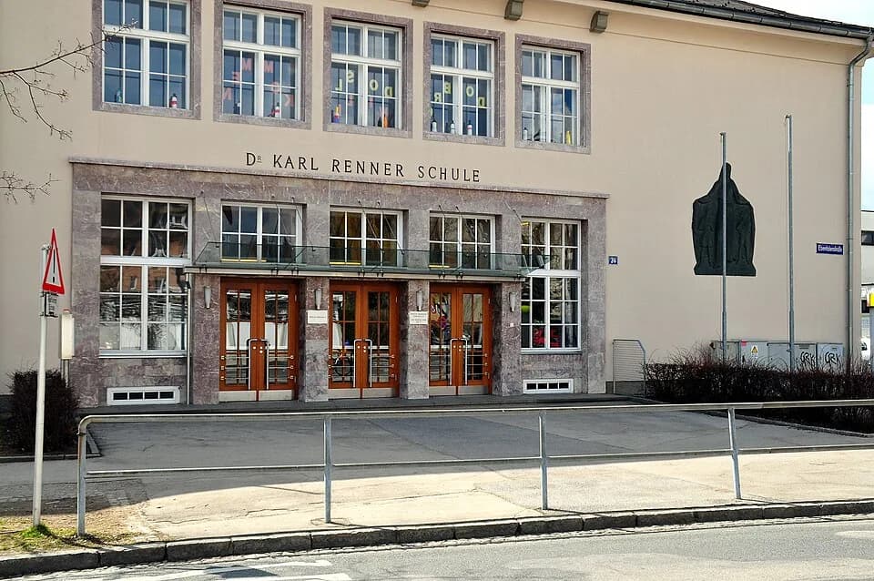 Karl Renner - Elementary school (with metal art-work by Otto Bestereimer on the right hand of the entrance) on the Ebentaler Street #24, 10th district “Saint Peter” of Klagenfurt, Carinthia, Austria