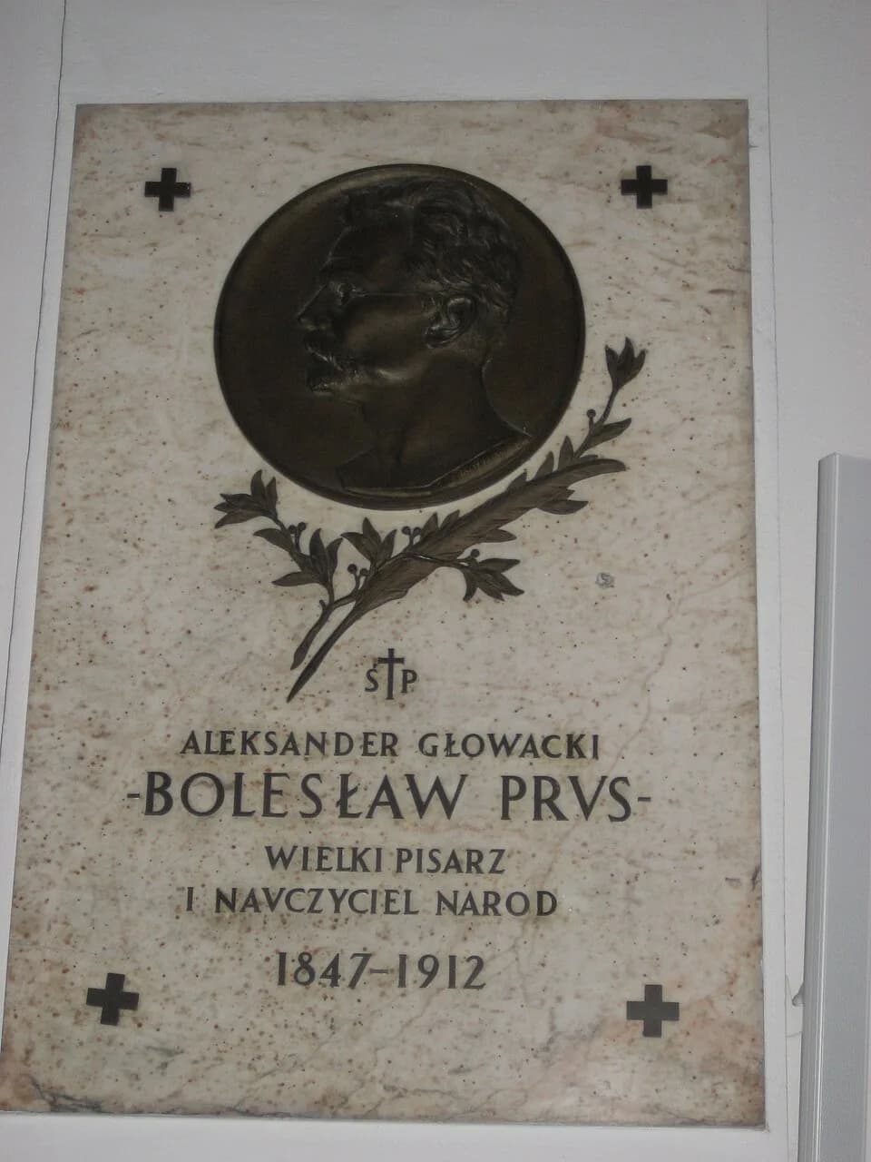 Bolesław Prus - Plaque on a pillar of the Holy Cross Church in Warsaw, Poland, commemorating "Aleksander Głowacki, BOLESŁAW PRUS, great writer and teacher of the nation, 1847-1912."
