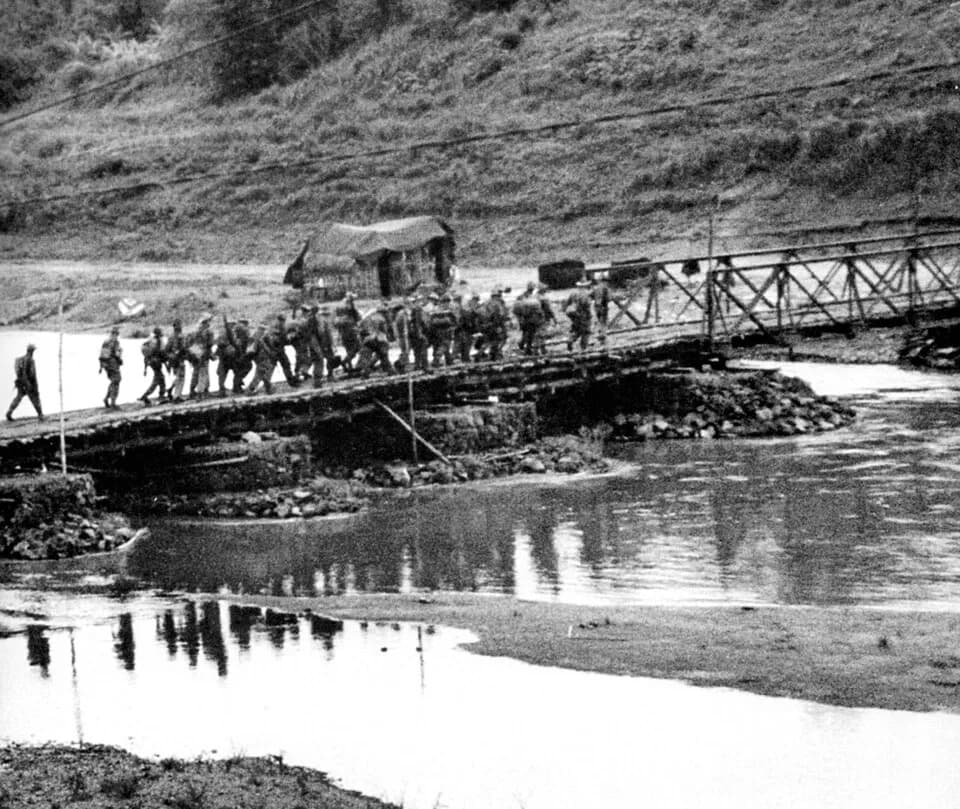 Robert Capa - Original quote in the The Eyewitness History of the Vietnam War : «After the fall of Dien Bien Phu supporting laotian troops fall back across the Mekong River into Laos»
en:Operation Con