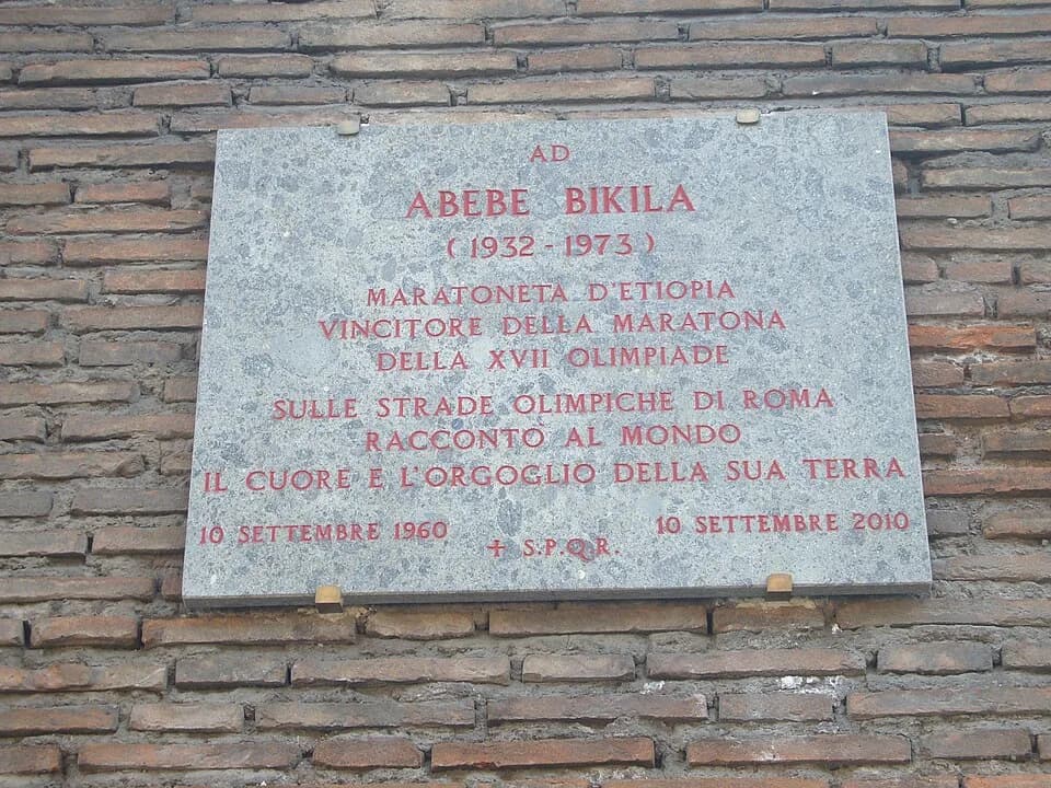 Abebe Bikila - Rome, Via di San Gregorio, plaque in memory of the 50th anniversary of Abebe Bikila's win in the 1960 Summer Olympics marathon.
The Plaque reads:
Marathon Man of EthiopiaWinner of the X