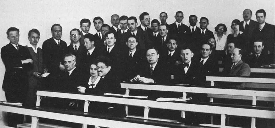 Max Delbrück - Copenhagen, spring 1932. People on the picture from left to right: 

Heisenberg, Werner Karl;
Hein, Piet;
Bohr, N.;
Brillouin, Leon Nicolas;
Rosenfeld, Leon;
Delbrück, Max;
Heitler, Wal