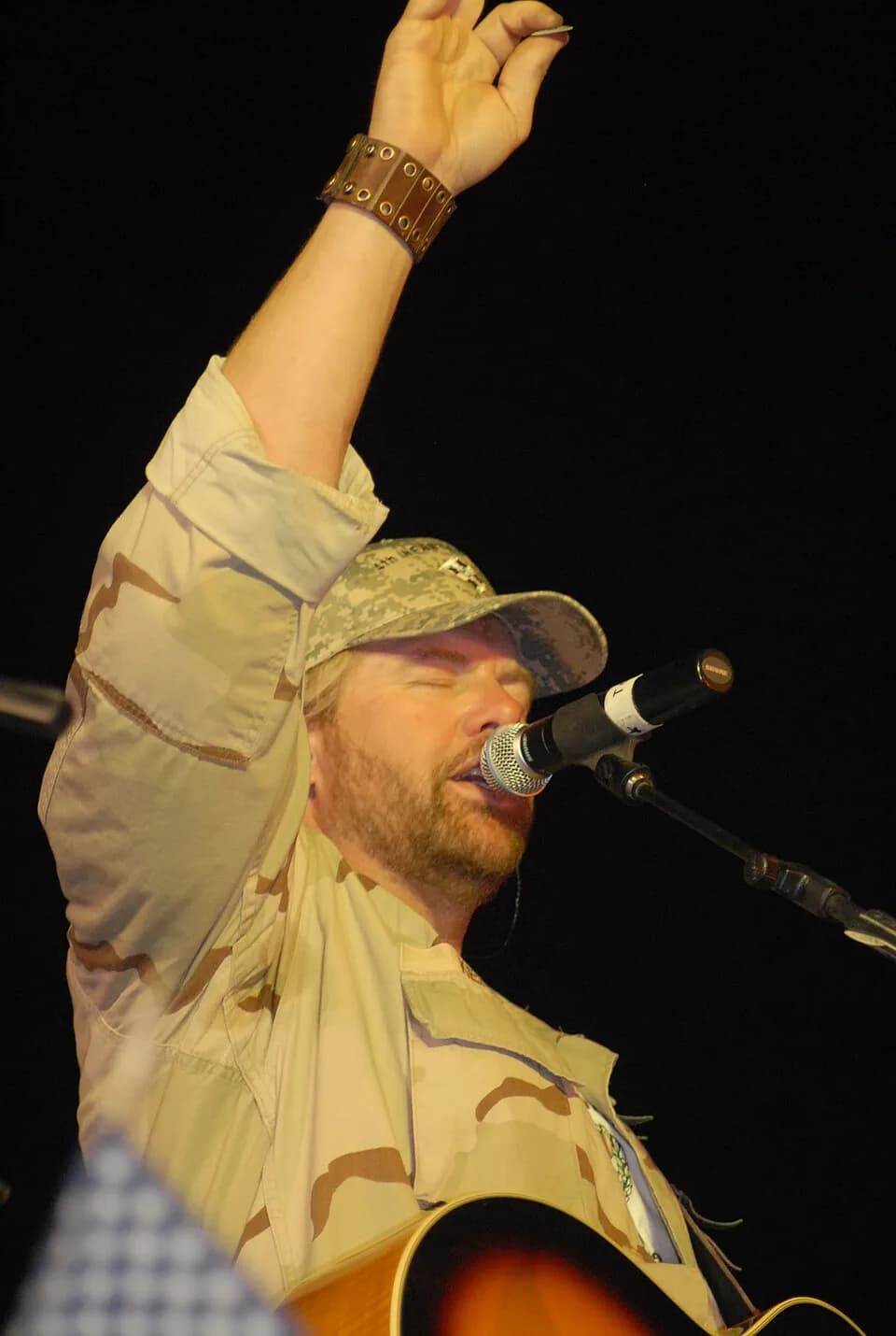 Toby Keith - Country music star Toby Keith performed on the Liberty Post Exchange stage at Camp Liberty, Iraq, on April 26. Keith is in country on his sixth United Services Organizations tour. "My fat
