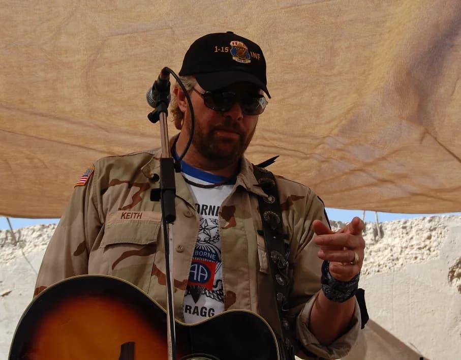 Toby Keith - Toby Keith plays an acoustic set for the Soldiers of 1-15th Infantry Regiment at Combat Outpost Carver, Salman Pak, Iraq, April 26. Keith included the outpost, on his sixth USO tour, to r