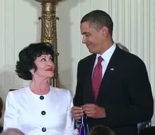 Chita Rivera - Chita Rivera, at the White House in August 2009, looks at Barack Obama prior to receiving the Presidential Medal of Freedom