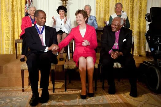 Chita Rivera - Former President of Ireland and United Nations High Commissioner for Human Rights, Mary Robinson, centre, congratulates actor and diplomat, Sidney Poitier, left, after he received the M