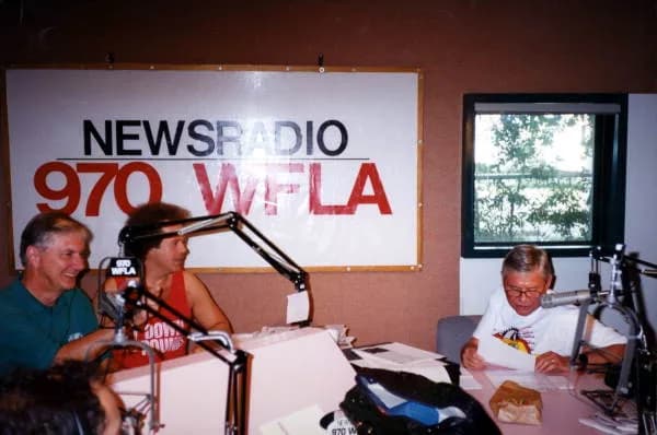 Richard Simmons - Governor Graham is shown at the microphone during one of his "workdays". His more than 180 jobs include policeman, railroad engineer, construction worker, sponge fisherman, factory w
