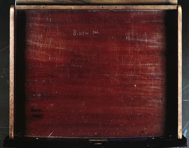 John F. Kennedy - Inside drawer of Senate chamber desk XCI occupied by Sen. Joe Biden during his time in the U.S. Senate. Note signature at upper center inside of the drawer.