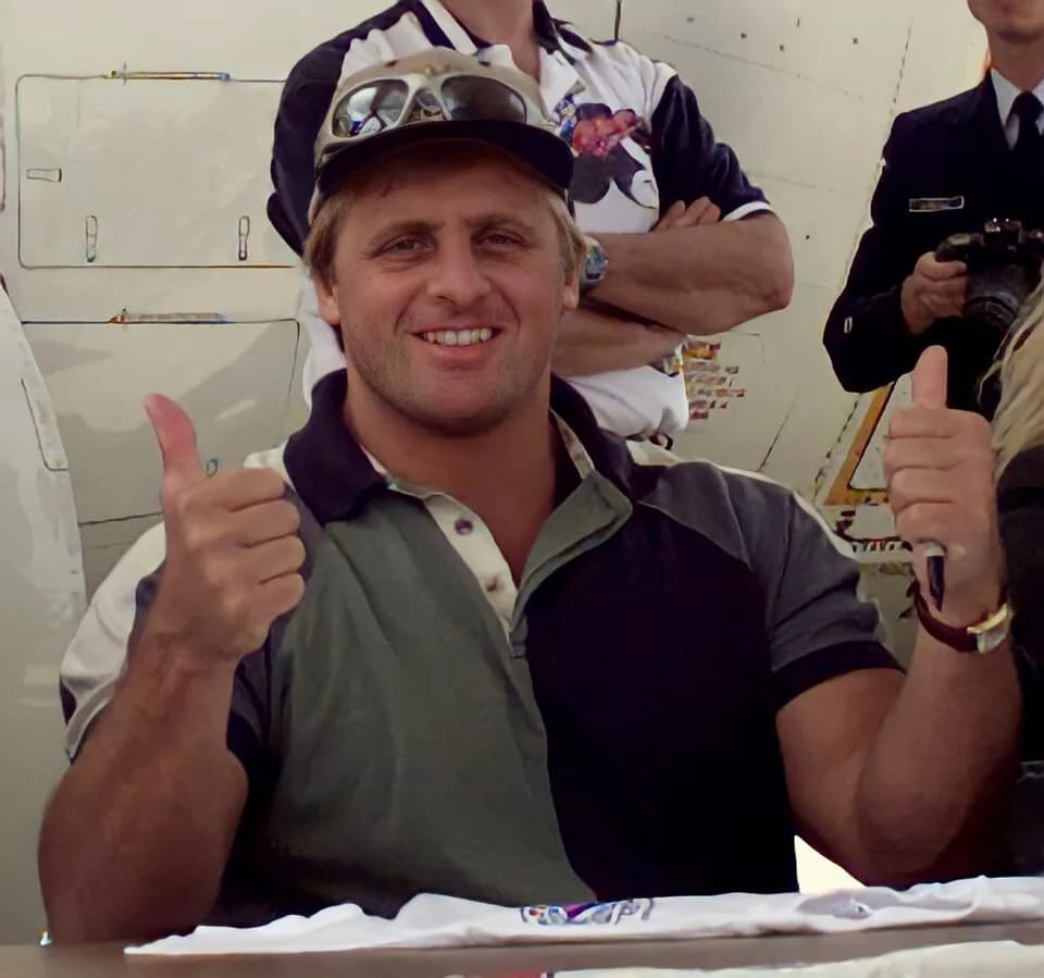 Owen Hart - Owen Hart takes a moment out of his autographing session to pose for the cameras. WWF wrestlers were guest of the Coast Guard at the annual airshow held on Andrews AFB.
