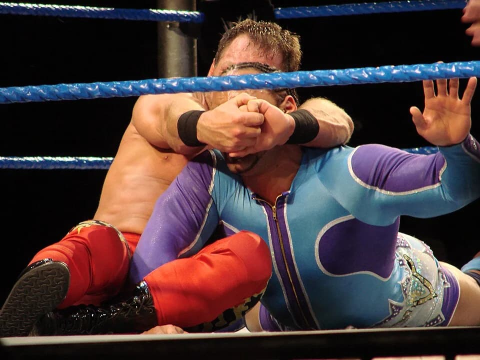 Chris Benoit - Chris Benoit does a Crippler crossface on Montel Ventavious Porter.