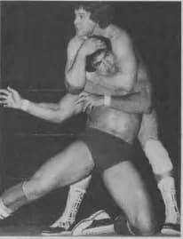 Roddy Piper - Roddy Piper applying a sleeperhold on Ricky Steamboat during a professional wrestling match, circa 1982