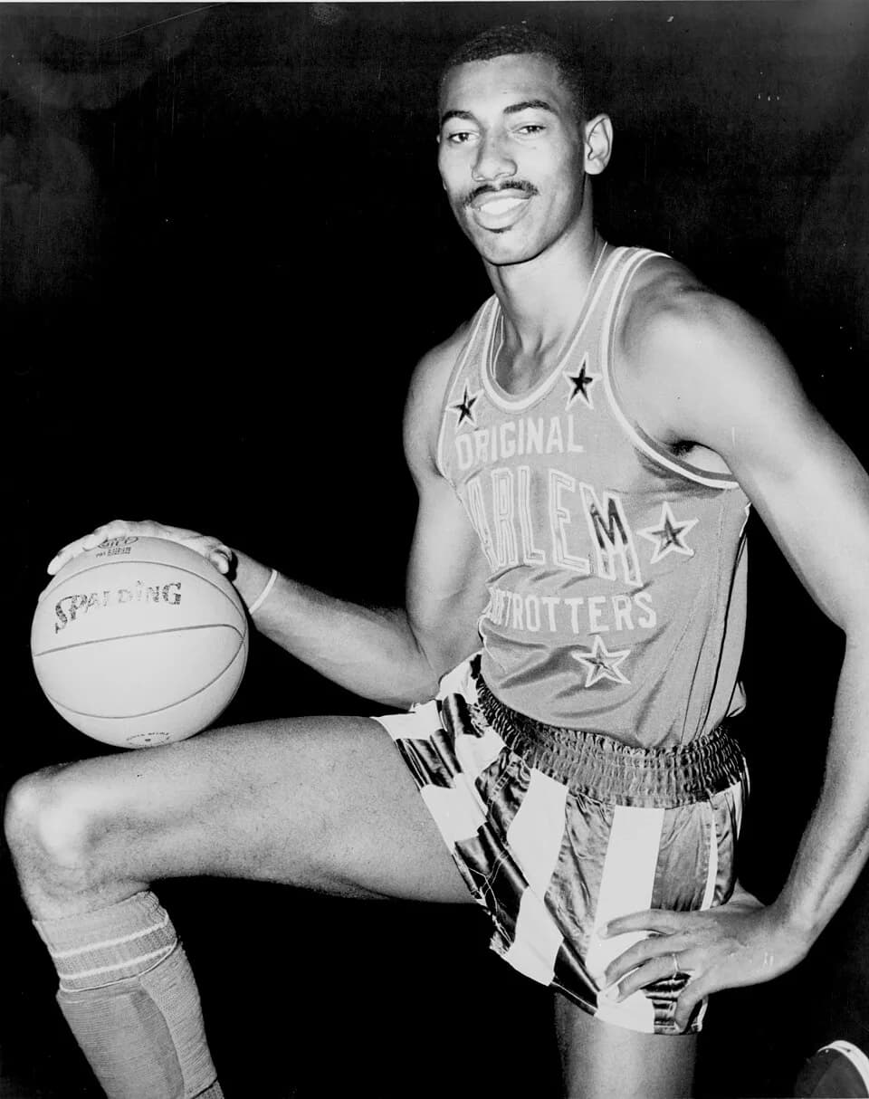 Wilt Chamberlain - Wilt Chamberlain, American basketball player wearing uniform of Harlem Globetrotters.