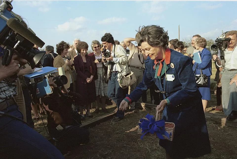 Lady Bird Johnson - Ground-breaking Ceremonies for the National Wildflower Research Center.  Lady Bird Johnson spreads seeds on the site of the National Wildflower Research Center.