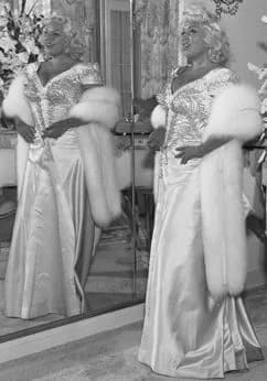 Mae West - Mae West posing in front of mirror for promotion