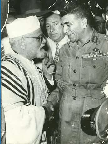 Mohamed Naguib - Egyptian President Muhammad Naguib (1901–1984) visits Haim Nahum Effendi (1872–1960), Chief Rabbi of Egypt, at the Sha'ar Hashamayim Synagogue in Cairo. According to Bassatine News, t
