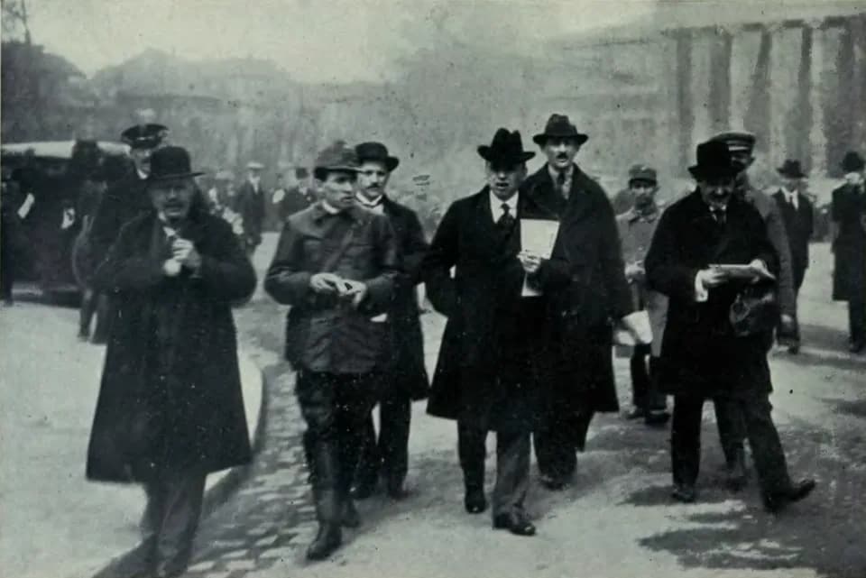 Béla Kun - Hungarian Communists Béla Kun, president of the Hungarian Soviet republic (in a hat, carrying papers in his left hand), and Commissar for Military Affairs Tibor Számuelly (in leather jacket