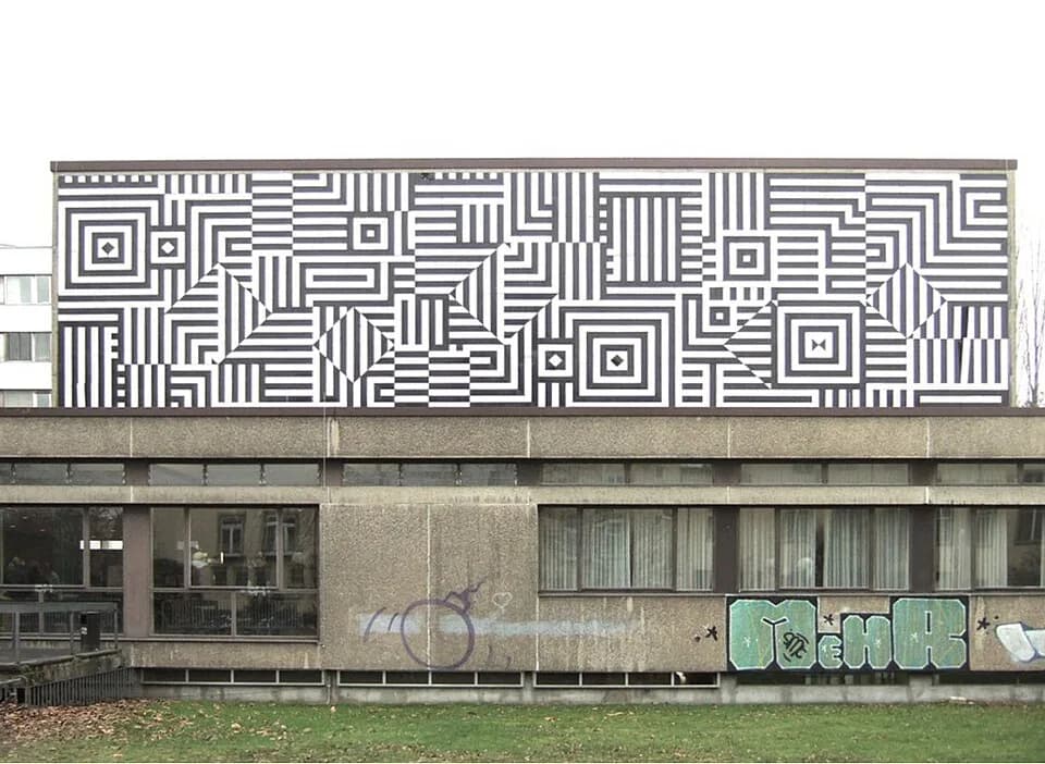 Victor Vasarely - Fassade des Bonner Juridicums von Victor Vasarely
Entwurf: 1965
Ausführung: 1969
Technik: Feuer-Emaille

Größe: 6 x 12 m