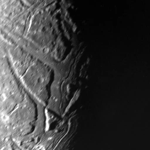 William Lassell - This highest-resolution Voyager 2 view of Ariel's terminator shows a complex array of transecting valleys with super-imposed impact craters. Voyager obtained this clear-filter, narro