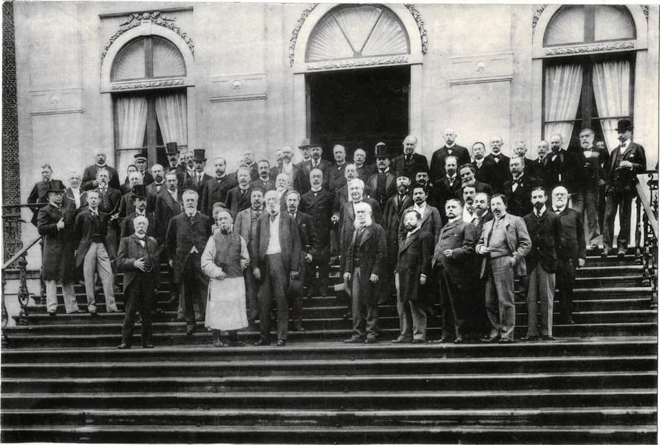 Auguste Beernaert - The delegates of the First Peace Conference (1899) pose on the steps of "Huis ten Bosch" Palace in The Hague.