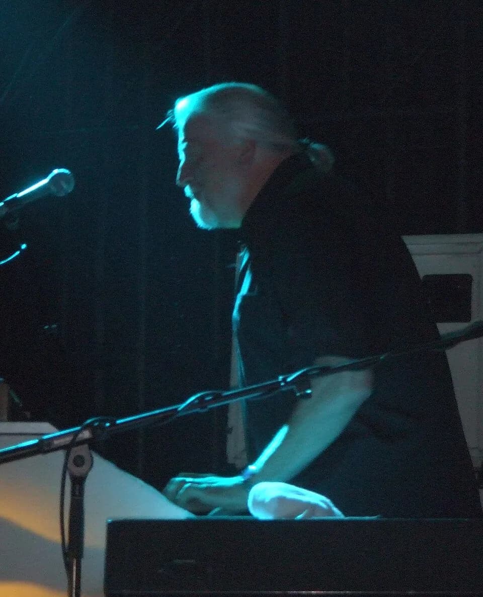 Jon Lord - cropped version of Jon Lord in black shirt, played keyboard instrument