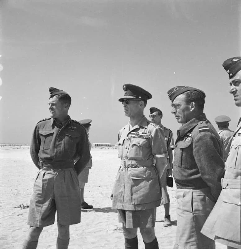 George II of Greece - The Greek Government in Exile during the Second World War
King George of the Hellenes with senior Royal Air Force officers in the Western Desert during his visit to a Greek fight