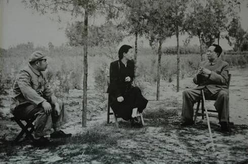 Jiang Qing - A man, Jiang Qing and Mao Zedong in conversation in Yan'an.