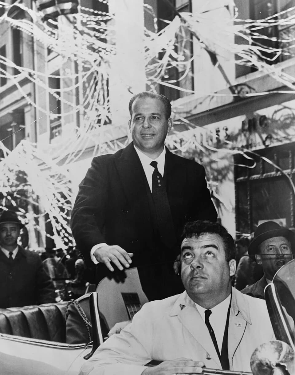João Goulart - João Goulart standing in back of car, during ticker tape parade, New York City.